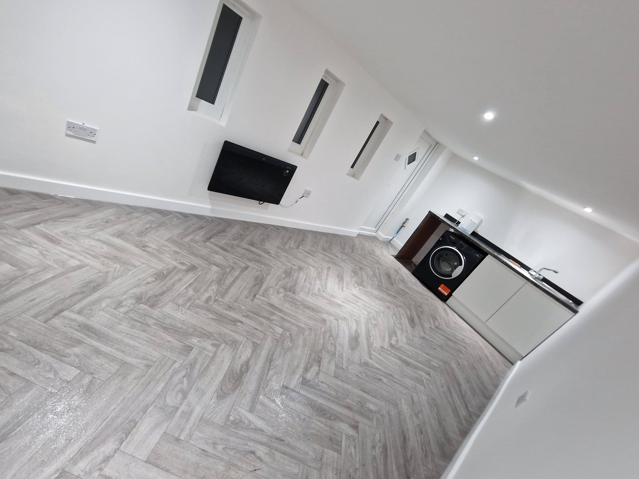 Finished conversion with herringbone flooring, Ashburys Property Renovations, Stockport