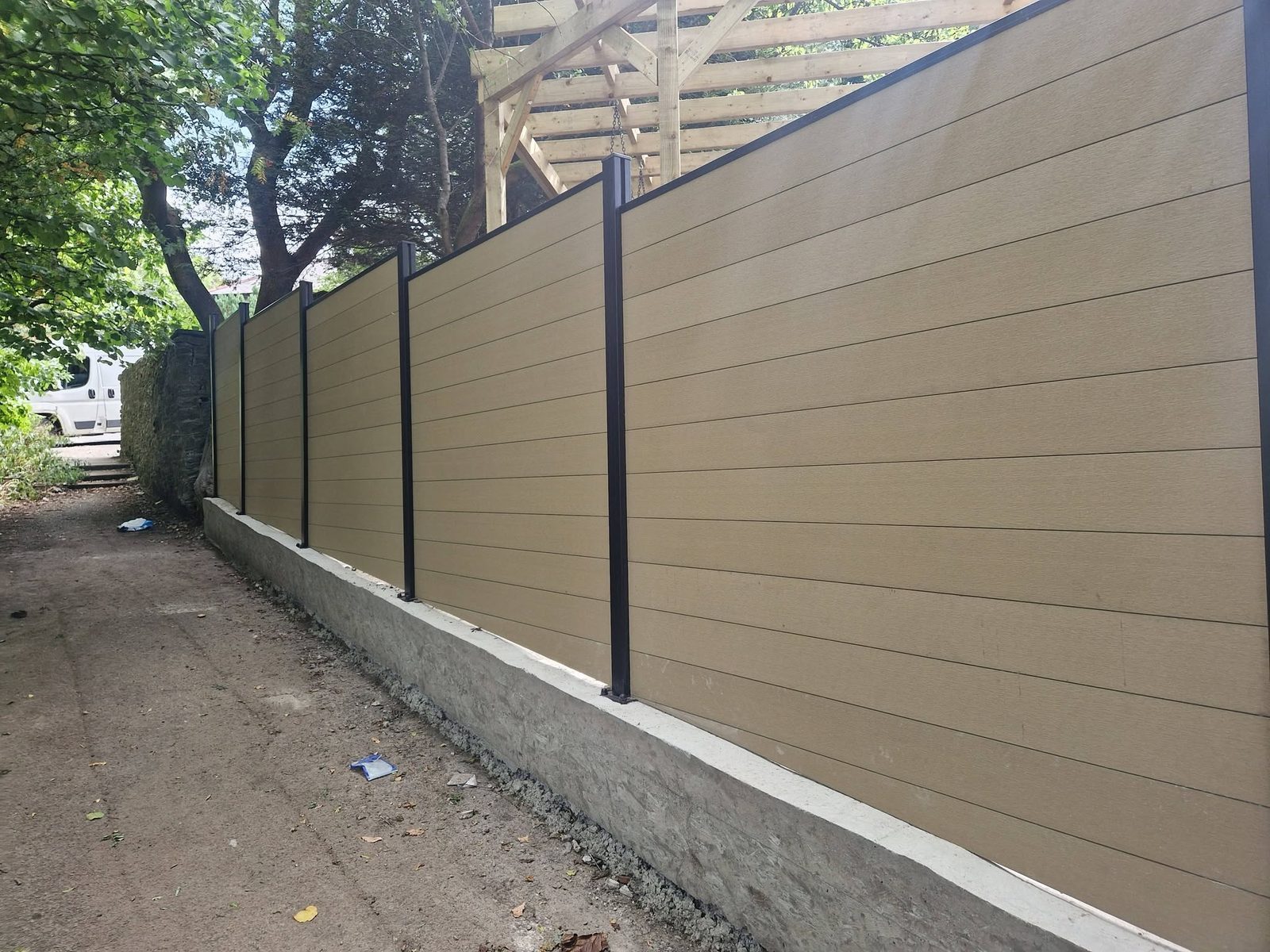 The full run of composite fencing on its concrete upstand