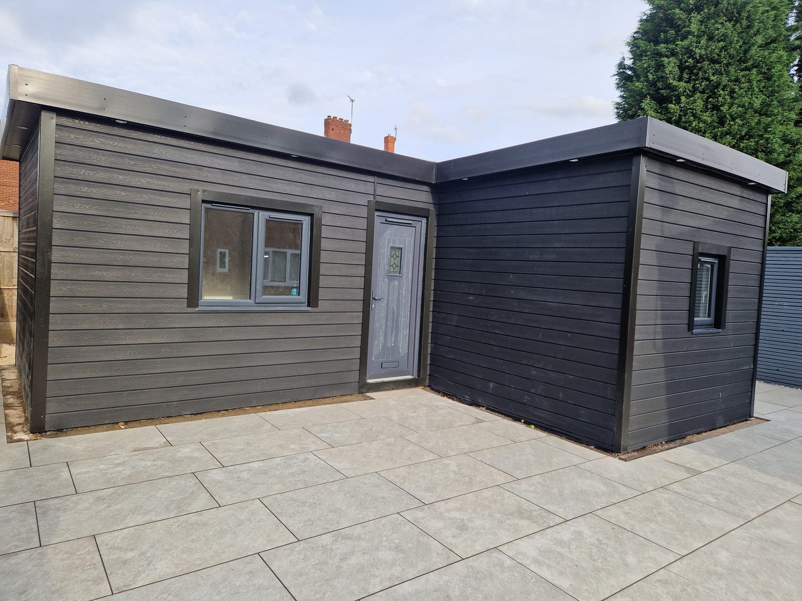 Composite clad garden room on a new porcelain patio