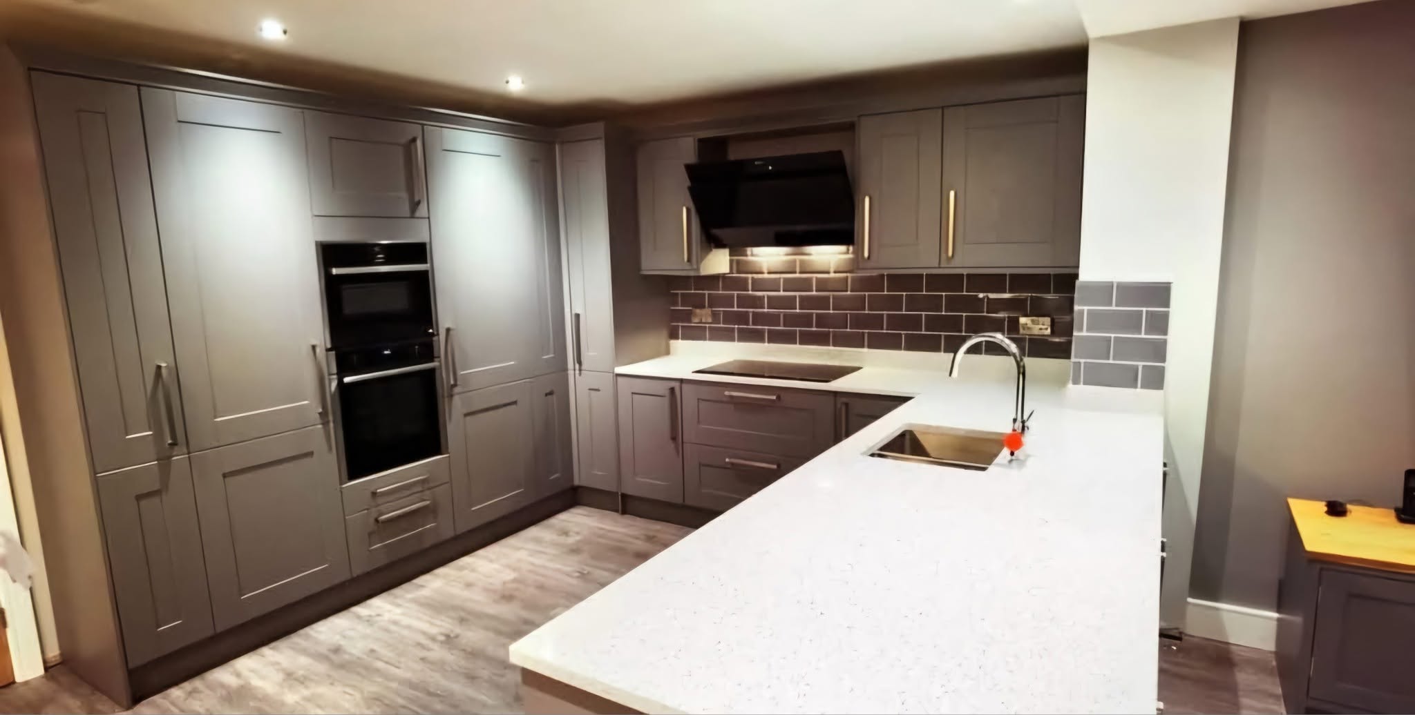Grey shaker kitchen with quartz worktops and a metro splashback, Ashburys Property Renovations, Stockport