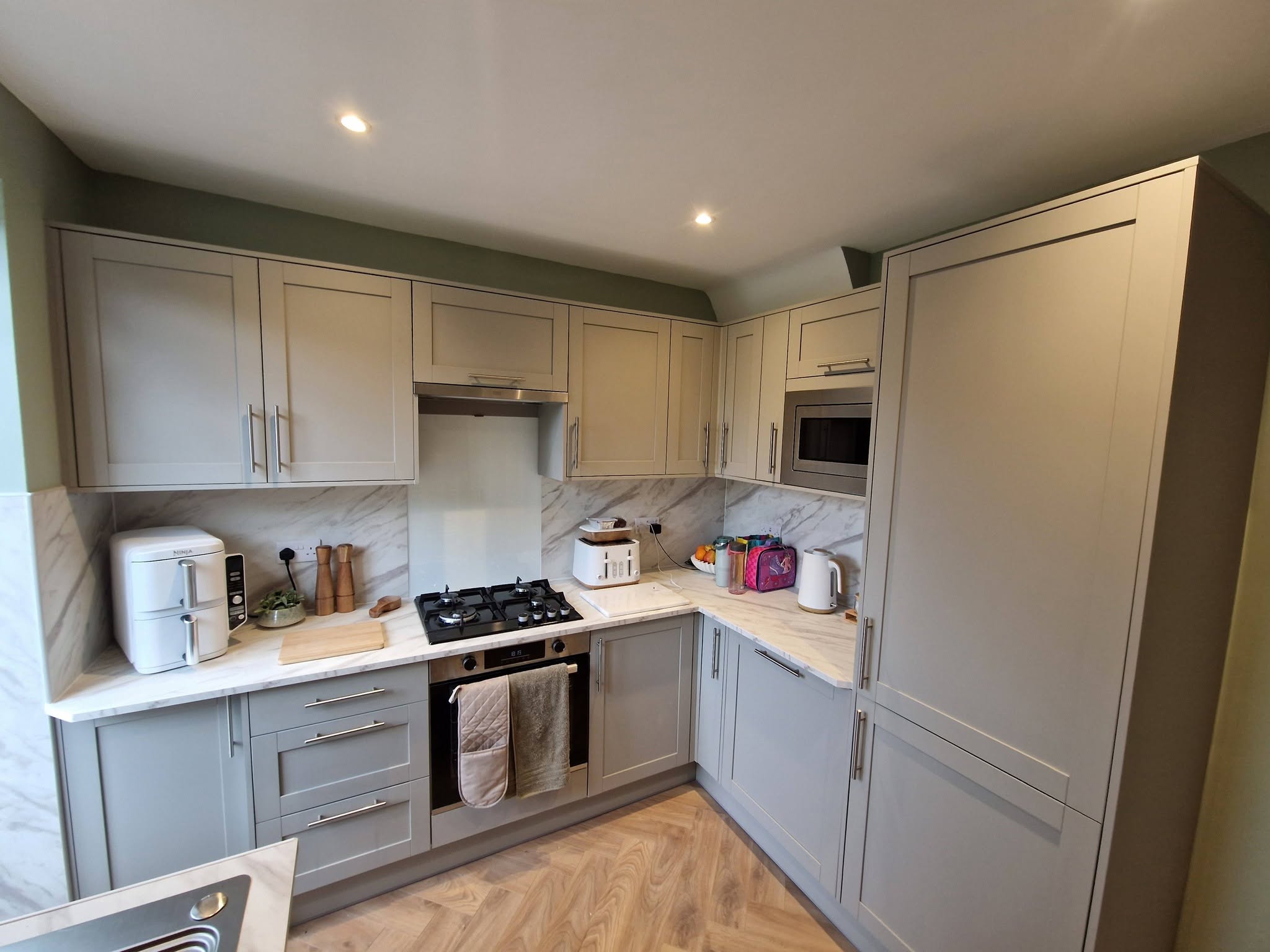 Fitted shaker kitchen renovation with marble splashback