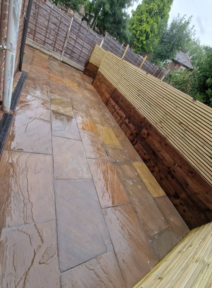 Sleeper steps and slatted fencing above the new patio